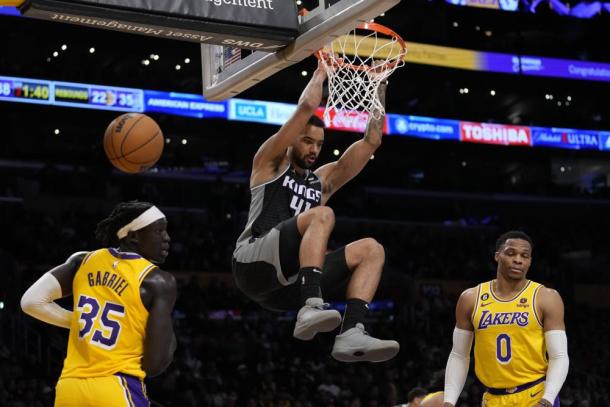 Sacramento Kings forward Trey Lyles (41) dunks against Los Angeles Lakers forward Wenyen Gabriel (35) and guard Russell Westbrook