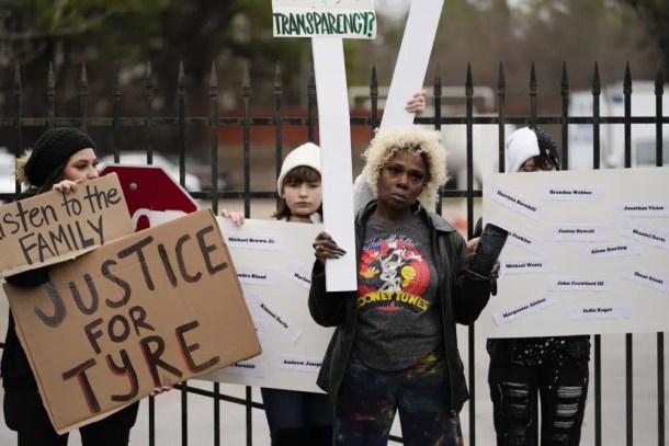 A group of demonstrators protest outside a police precinct in response to the death of Tyre Nichols