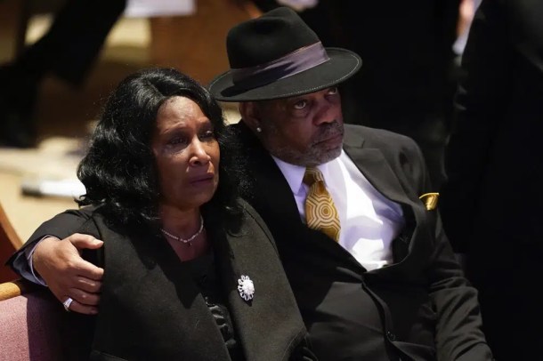 RowVaughn Wells cries as she and her husband Rodney Wells